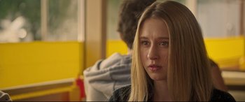 Movie still from “The Final Girls” (2015), directed by Todd Strauss-Schulson – A young woman with long blonde hair stares into the camera; Close Up shot, Over the shoulder angle