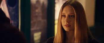 Movie still from “The Final Girls” (2015), directed by Todd Strauss-Schulson – A woman with long blonde hair is looking at the camera; Close Up shot, Over the shoulder angle