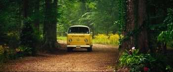 Movie still from “The Final Girls” (2015), directed by Todd Strauss-Schulson – A yellow van is parked on the side of the road; Wide shot, High angle