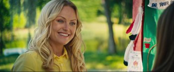 Movie still from “The Final Girls” (2015), directed by Todd Strauss-Schulson – A beautiful blond haired woman wearing a yellow shirt; Close Up shot, Over the shoulder angle