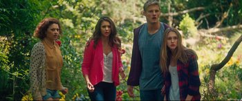 Movie still from “The Final Girls” (2015), directed by Todd Strauss-Schulson – A group of young people walking through a forest; Medium shot, High angle