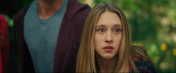 Movie still from “The Final Girls” (2015), directed by Todd Strauss-Schulson – A young woman with long hair and a blue shirt; Close Up shot, Over the shoulder angle