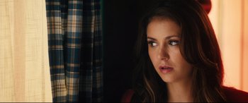 Movie still from “The Final Girls” (2015), directed by Todd Strauss-Schulson – A person looking at the camera; Close Up shot, Over the shoulder angle