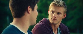Movie still from “The Final Girls” (2015), directed by Todd Strauss-Schulson – Two young men are talking to each other; Close Up shot, Over the shoulder angle