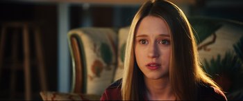 Movie still from “The Final Girls” (2015), directed by Todd Strauss-Schulson – A person sitting in a chair; Close Up shot, Over the shoulder angle