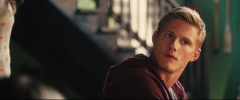 Movie still from “The Final Girls” (2015), directed by Todd Strauss-Schulson – A person wearing a hooded sweatshirt; Close Up shot, Over the shoulder angle