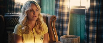 Movie still from “The Final Girls” (2015), directed by Todd Strauss-Schulson – A woman sitting in a chair wearing a yellow shirt; Close Up shot, Over the shoulder angle