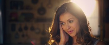 Movie still from “The Final Girls” (2015), directed by Todd Strauss-Schulson – A beautiful young lady with long brown wavy hair; Close Up shot, High angle