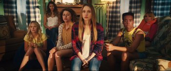 Movie still from “The Final Girls” (2015), directed by Todd Strauss-Schulson – A group of young people sitting in a room; Medium shot, High angle