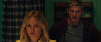 Movie still from “The Final Girls” (2015), directed by Todd Strauss-Schulson – A woman and a man sitting next to each other in a room; Close Up shot, Over the shoulder angle