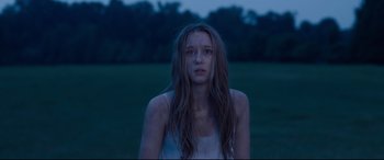 Movie still from “The Final Girls” (2015), directed by Todd Strauss-Schulson – A woman with long hair standing in a grassy field; Close Up shot, Low angle