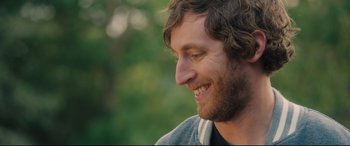 Movie still from “The Final Girls” (2015), directed by Todd Strauss-Schulson – A man's face with trees in the background; Close Up shot, Over the shoulder angle