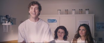 Movie still from “The Final Girls” (2015), directed by Todd Strauss-Schulson – A man and a woman standing next to each other in a room; Medium shot, Low angle