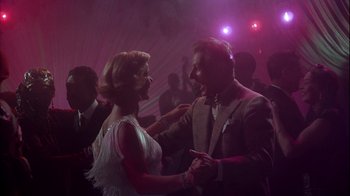 Movie still from “The Five Pennies” (1959), directed by Melville Shavelson – A man and a woman are dancing in a club; Medium shot, Low angle