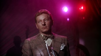 Movie still from “The Five Pennies” (1959), directed by Melville Shavelson – A man wearing a suit and bow tie; Close Up shot, Low angle