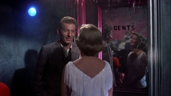 Movie still from “The Five Pennies” (1959), directed by Melville Shavelson – A man and a woman are standing in front of a mirror; Medium shot, Over the shoulder angle