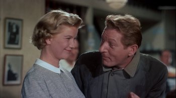 Movie still from “The Five Pennies” (1959), directed by Melville Shavelson – A man and a woman standing next to each other; Close Up shot, Low angle