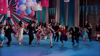 Movie still from “The Five Pennies” (1959), directed by Melville Shavelson – A group of people dancing on a blue floor; Wide shot, High angle