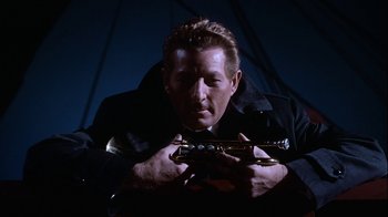 Movie still from “The Five Pennies” (1959), directed by Melville Shavelson – A man in a black jacket holding a trumpet; Close Up shot, Low angle