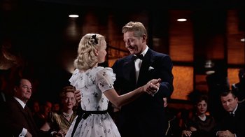 Movie still from “The Five Pennies” (1959), directed by Melville Shavelson – A man and a woman are dancing together; Medium shot, Low angle