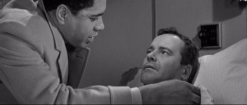 Movie still from “The Fortune Cookie” (1966), directed by Billy Wilder – A man and a boy looking at one another; Close Up shot, Over the shoulder angle