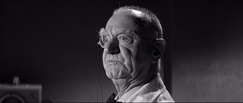 Movie still from “The Fortune Cookie” (1966), directed by Billy Wilder – An old man with a strange look on his face; Close Up shot, Low angle