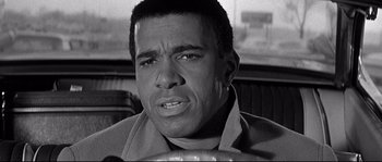 Movie still from “The Fortune Cookie” (1966), directed by Billy Wilder – Black and white photograph of a man in a restaurant; Close Up shot, Low angle