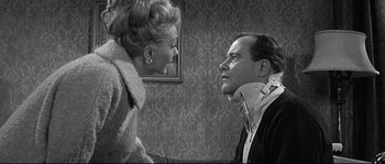 Movie still from “The Fortune Cookie” (1966), directed by Billy Wilder – An older man and a younger woman looking at each other; Medium shot, Over the shoulder angle