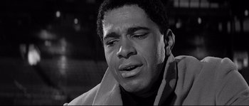 Movie still from “The Fortune Cookie” (1966), directed by Billy Wilder – A black and white photo of a man crying; Close Up shot, Low angle