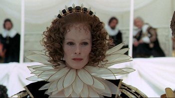 Movie still from “The Four Musketeers: Milady's Revenge” (1974), directed by Richard Lester – A person wearing a crown; Close Up shot, Over the shoulder angle