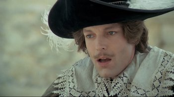 Movie still from “The Four Musketeers: Milady's Revenge” (1974), directed by Richard Lester – A person wearing a hat; Close Up shot, Over the shoulder angle