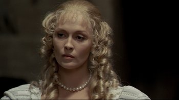 Movie still from “The Four Musketeers: Milady's Revenge” (1974), directed by Richard Lester – A person with long hair; Close Up shot, Over the shoulder angle