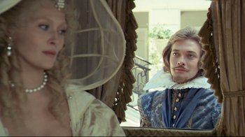 Movie still from “The Four Musketeers: Milady's Revenge” (1974), directed by Richard Lester – A man and a woman are looking at each other in a mirror; Close Up shot, Over the shoulder angle