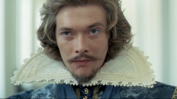 Movie still from “The Four Musketeers: Milady's Revenge” (1974), directed by Richard Lester – A person with a beard; Close Up shot, Over the shoulder angle
