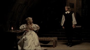 Movie still from “The Four Musketeers: Milady's Revenge” (1974), directed by Richard Lester – A man and a woman dressed in medieval clothing; Wide shot, Low angle