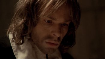 Movie still from “The Four Musketeers: Milady's Revenge” (1974), directed by Richard Lester – A person with long brown hair; Close Up shot, High angle