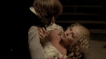 Movie still from “The Four Musketeers: Milady's Revenge” (1974), directed by Richard Lester – A man and a woman in a white wedding dress; Close Up shot, Over the shoulder angle