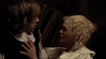 Movie still from “The Four Musketeers: Milady's Revenge” (1974), directed by Richard Lester – A man and a woman in a room with an umbrella; Close Up shot, Overhead angle