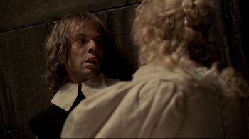 Movie still from “The Four Musketeers: Milady's Revenge” (1974), directed by Richard Lester – A man and a woman are talking to each other; Close Up shot, Overhead angle