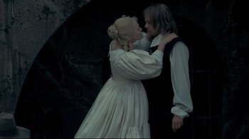 Movie still from “The Four Musketeers: Milady's Revenge” (1974), directed by Richard Lester – A man and a woman dressed in period clothing; Medium shot, High angle