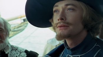 Movie still from “The Four Musketeers: Milady's Revenge” (1974), directed by Richard Lester – A person wearing a cowboy hat; Close Up shot, Low angle