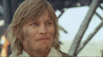 Movie still from “The Four Musketeers: Milady's Revenge” (1974), directed by Richard Lester – A person wearing a shirt and tie; Close Up shot, Low angle
