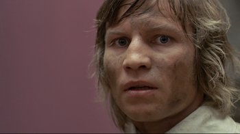 Movie still from “The Four Musketeers: Milady's Revenge” (1974), directed by Richard Lester – A person wearing a white shirt; Close Up shot, Low angle