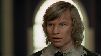 Movie still from “The Four Musketeers: Milady's Revenge” (1974), directed by Richard Lester – A person with long blonde hair; Close Up shot, Low angle