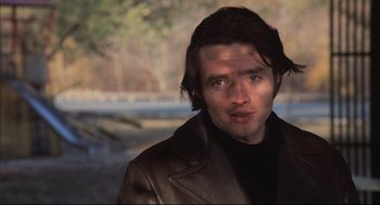 Movie still from “The Friends of Eddie Coyle” (1973), directed by Peter Yates – A person wearing a leather jacket; Close Up shot, Low angle