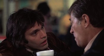 Movie still from “The Friends of Eddie Coyle” (1973), directed by Peter Yates – A man and a woman talking to each other; Close Up shot, Over the shoulder angle