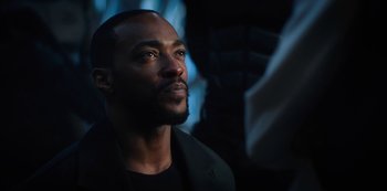 Movie still from “Altered Carbon” (2018), created by Laeta Kalogridis – A person wearing a suit; Close Up shot, Over the shoulder angle