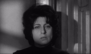 Movie still from “The Fugitive Kind” (1960), directed by Sidney Lumet – A black - and - white photo of a woman in a black sweater; Close Up shot, Low angle