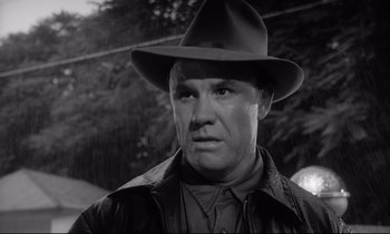 Movie still from “The Fugitive Kind” (1960), directed by Sidney Lumet – A black and white photo of a man wearing a hat; Close Up shot, Low angle