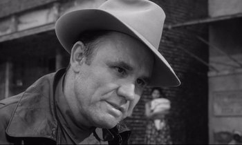 Movie still from “The Fugitive Kind” (1960), directed by Sidney Lumet – A black and white photo of a man wearing a hat; Close Up shot, Low angle